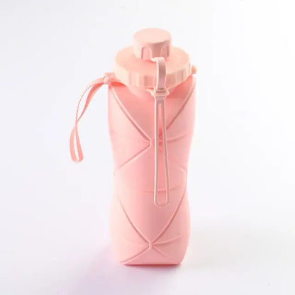 Pink folding water cup for outdoor use, compact and portable design.