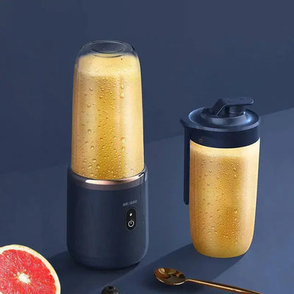 Portable juicer cup blending fresh juice with replacement cup.