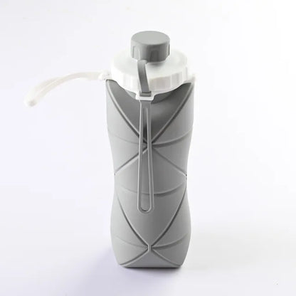 Gray folding water cup for outdoor adventures.