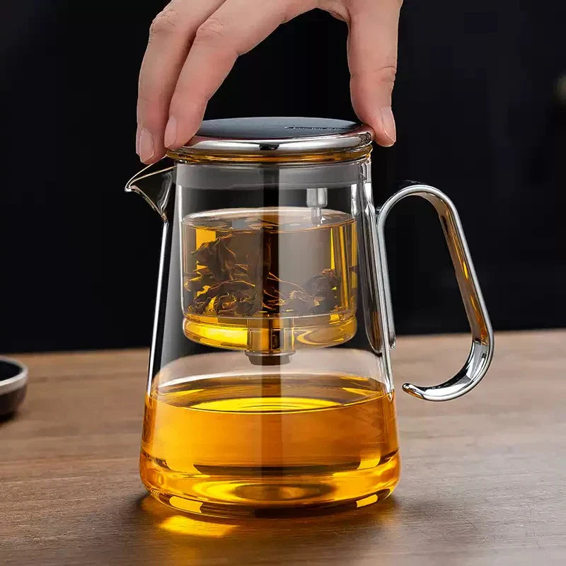 Magnetic switch tea maker with built-in glass filter and metal handle.