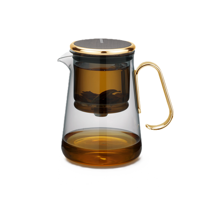 Magnetic switch tea maker with glass filter and golden handle.