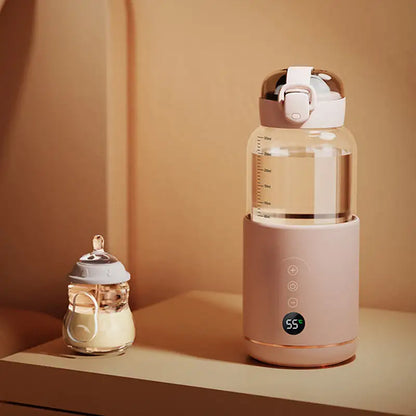 Smart baby bottle warmer with digital temperature display and small milk bottle nearby.