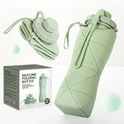 Green silicone folding water bottle, compact and portable design for outdoor adventures.