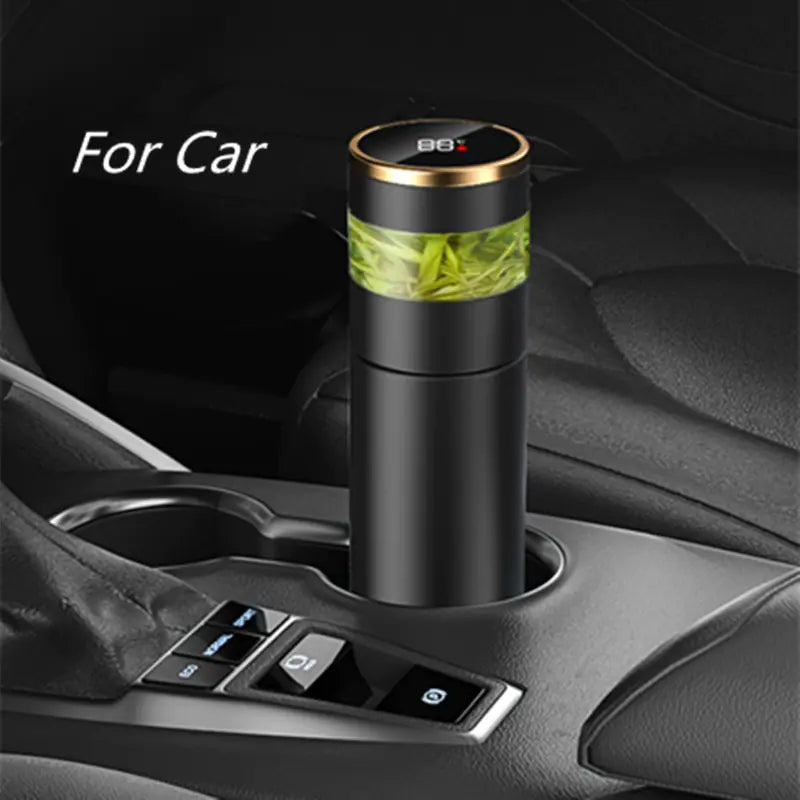 Smart thermos bottle with temperature display in car cup holder, ideal for maintaining beverage temperature on the go.