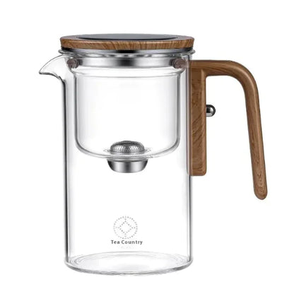 Elegant glass teapot with wooden handle and lid, designed for sophisticated tea brewing.