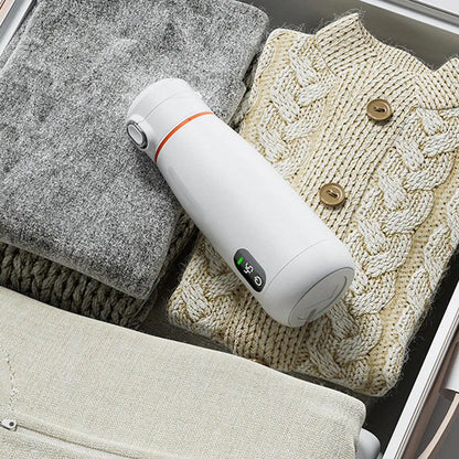 Intelligent insulation cup placed inside a suitcase with cozy items.