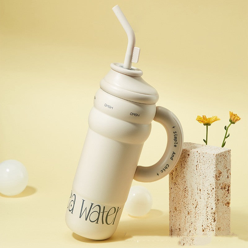 Large stainless steel vacuum cup with handle and tea separator, includes straw, keeps drinks warm, ideal for home and portable use.