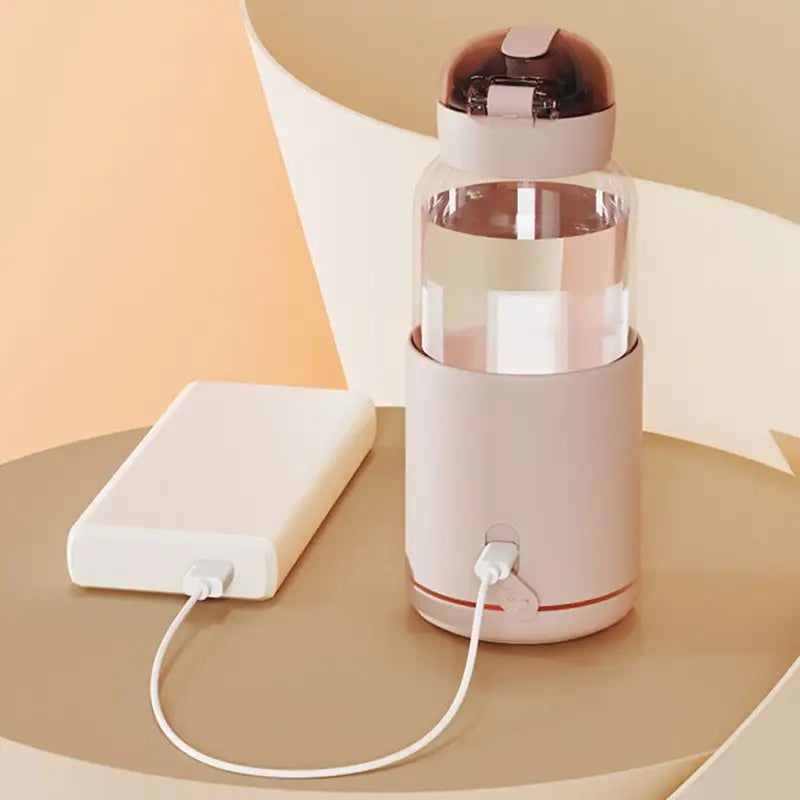 Smart baby bottle warmer with portable design, ideal for maintaining optimal beverage temperature.